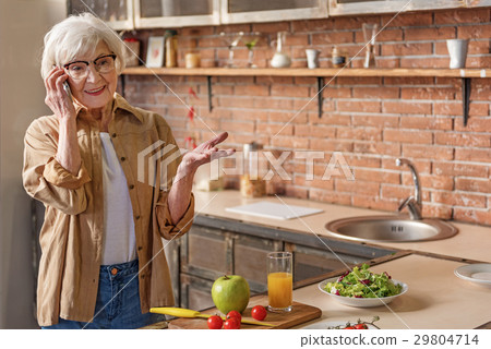 Healthy old lady communication on telephone 29804714