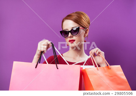 young woman with colorful shopping bags 29805506