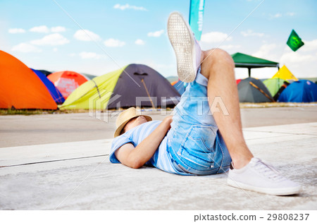 Unrecognizable on summer music festival, lying on Unrecognizable on summer music festival, lying on 29808237