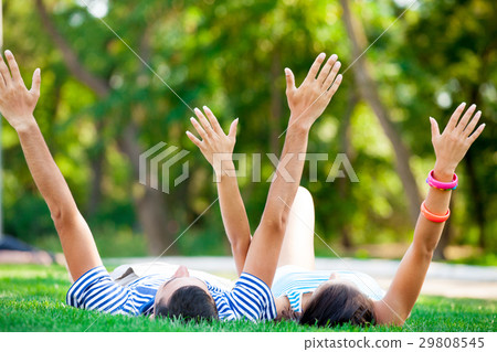 cute couple raising their hands 29808545