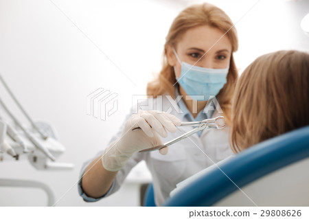 Wonderful experienced dentist removing patients 29808626