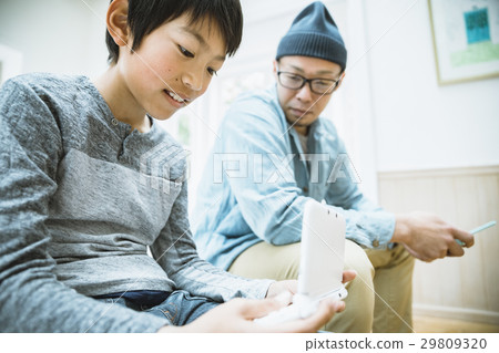 Parents playing with mobile games 29809320