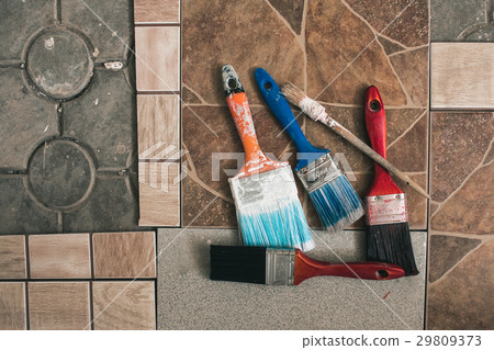 Paint brushes on the old tile background Paint brushes on the old tile background 29809373