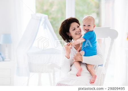 Mother and baby in bedroom 29809495