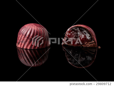 chocolate candy on black background 29809712