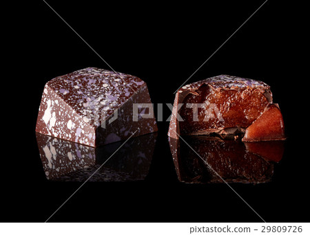 chocolate candy on black background 29809726