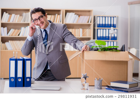 Man moving office with box and his belongings Man moving office with box and his belongings 29811931