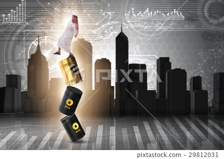 Arab businessman losing balance on oil barrels 29812031