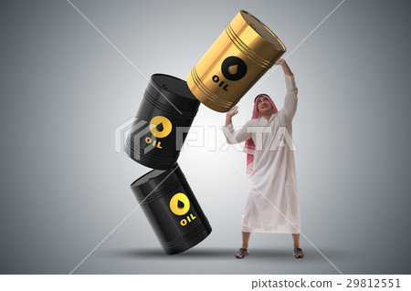 Arab businessman holding oil barrel Arab businessman holding oil barrel 29812551