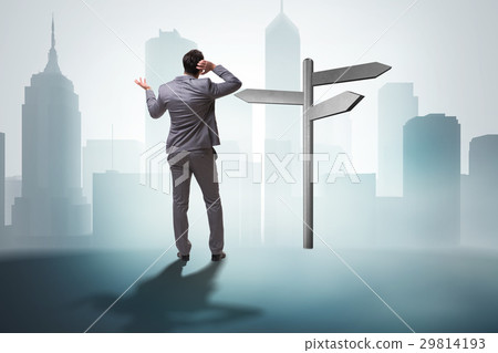 Businessman in difficult choice concept 29814193