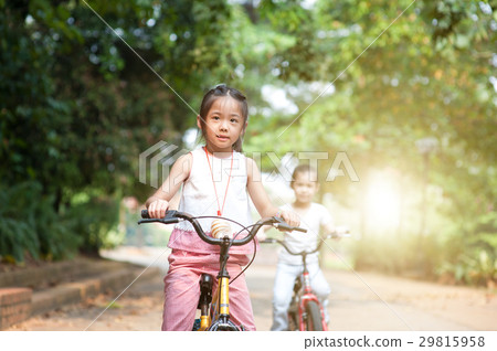 Children riding bikes outdoor. Children riding bikes outdoor. 29815958