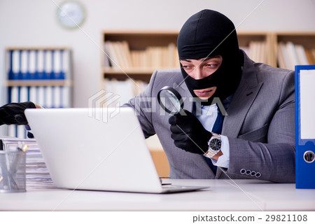 Criminal businessman with balaclava in office Criminal businessman with balaclava in office 29821108