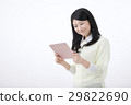 A young woman with a tablet PC 29822690