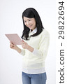 A young woman with a tablet PC 29822694