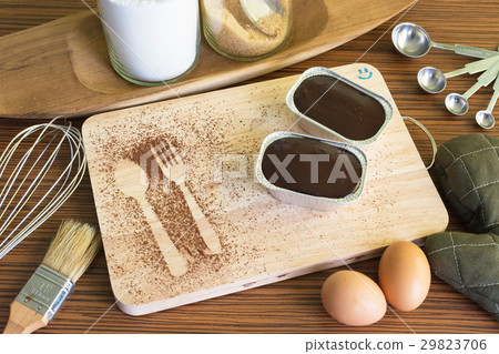 Chocolate fudge cake, Bakery tools on wooden table Chocolate fudge cake, Bakery tools on wooden table 29823706