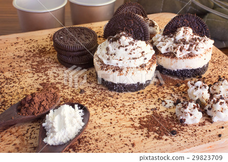 Oreo Cheese Cake and Bakery tools on table Oreo Cheese Cake and Bakery tools on table 29823709