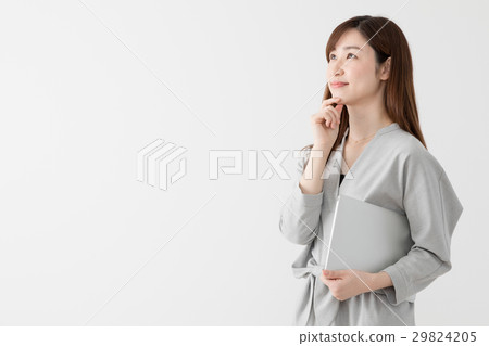 Woman holding a laptop computer, business Woman holding a laptop computer, business 29824205
