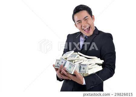 A lot of money in the hands of a young businessman 29826015