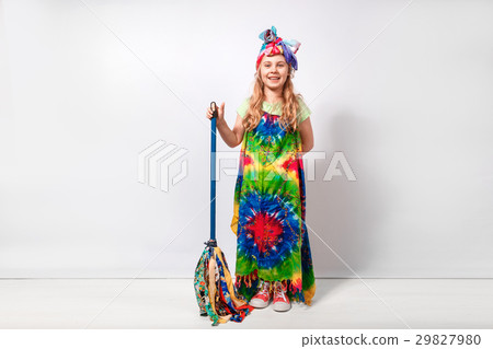 Happy blonde child girl in hippie colorful dress 29827980