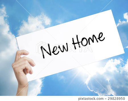 New Home  Sign on white paper. Man Hand Holding New Home  Sign on white paper. Man Hand Holding 29828950
