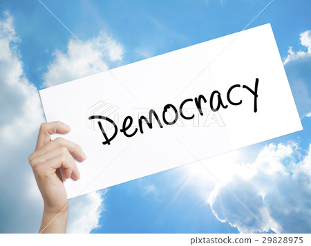 Democracy Sign on white paper. Man Hand Holding Democracy Sign on white paper. Man Hand Holding 29828975