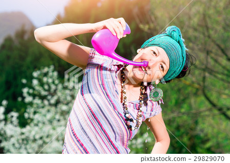 Jala neti nasal irrigation with a woman who practice in spring n Jala neti nasal irrigation with a woman who practice in spring n 29829070