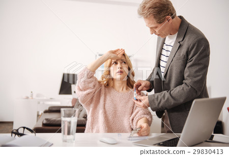 Upset young manager having high temperature in the 29830413