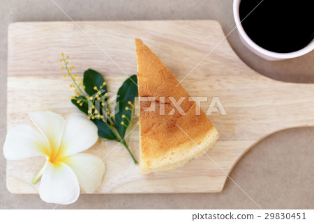 Japanese style Cheesecake, top view on wood plate. Japanese style Cheesecake, top view on wood plate. 29830451