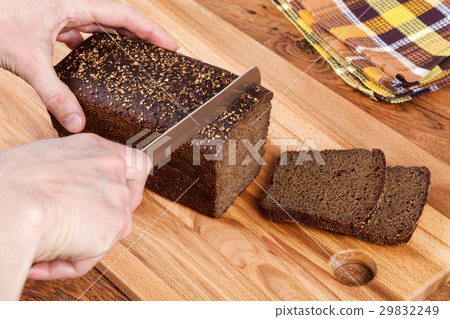 Cutting Black Bread 29832249