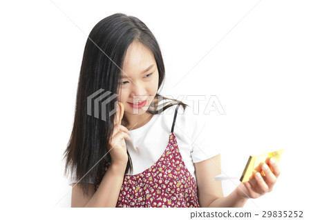 Attractive Asian woman Applying Her Makeup Attractive Asian woman Applying Her Makeup 29835252