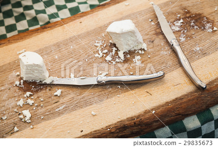 Cheese with knives lay on wooden cutting desk Cheese with knives lay on wooden cutting desk 29835673