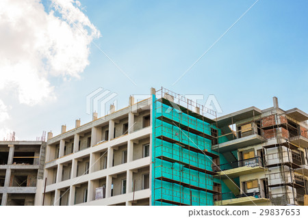 building under construction against blue sky 29837653