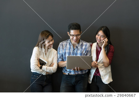 Group Of Business people with casual suit Meeting in looking at the tablet action In the modern coffee shop, closeup at finger, business group concept Group Of Business people with casual suit Meeting in looking at the tablet action In the modern coffee shop, closeup at finger, business group concept 29840667