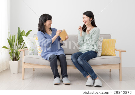 A girl receiving pocket money from my mother A girl receiving pocket money from my mother 29840873