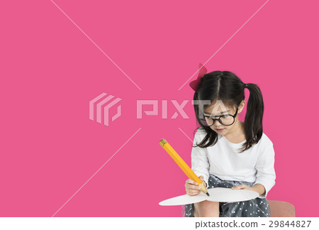 Little girl studio isolated writing on notebook 29844827