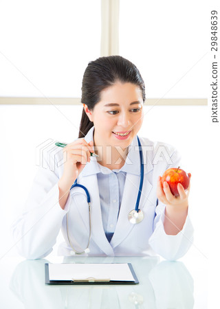 Young asian nutritionist doctor writing diet plan 29848639