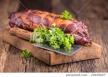 Traditional smoked pork meat on oak wooden table. Traditional smoked pork meat on oak wooden table. 29849897