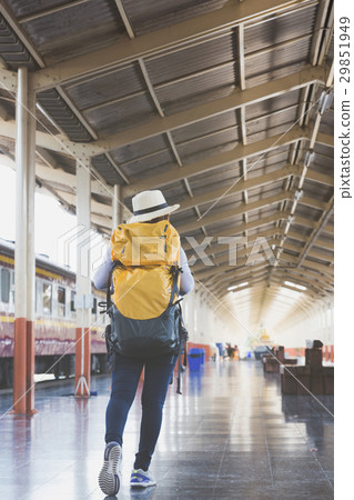 woman on train station platform with backpack woman on train station platform with backpack 29851949