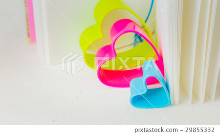 Blue red and green hearts inside an open diary Blue red and green hearts inside an open diary 29855332