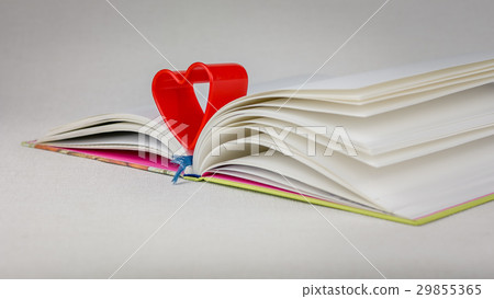 Red heart over diary book on white table Red heart over diary book on white table 29855365
