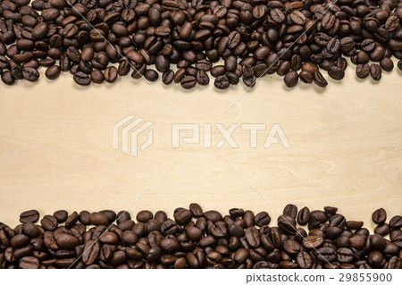 Coffee beans on the wood background. Coffee beans on the wood background. 29855900