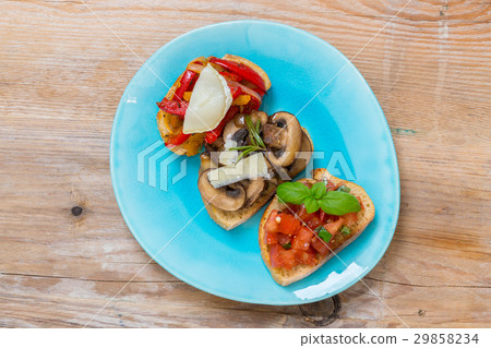 Bruschetta with tomatoes, mushrooms, goat's cheese Bruschetta with tomatoes, mushrooms, goat's cheese 29858234