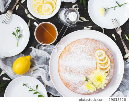 Lemon pie, cup of tea on decorated wooden table 29858526
