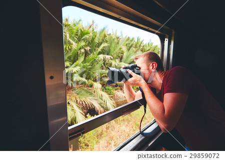 Man traveling by historical train Man traveling by historical train 29859072