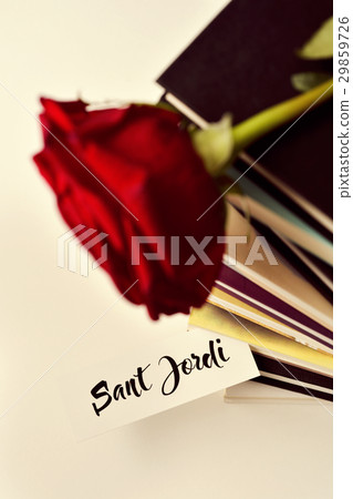 books, red rose and text Sant Jordi 29859726