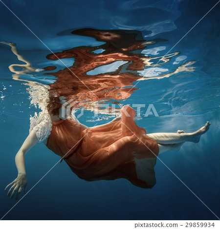 Girl in a red dress under the water Girl in a red dress under the water 29859934