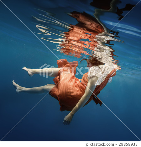 Girl in a red dress under the water Girl in a red dress under the water 29859935