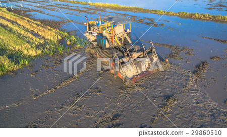farmer use tractor prepare the ground 29860510