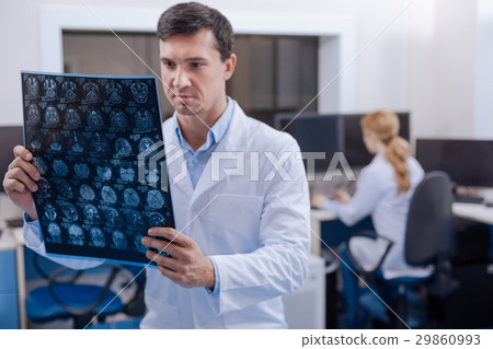 Serious professional doctor working in the 29860993