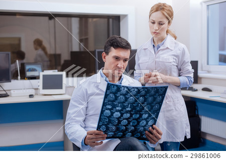 Handsome confident oncologist thinking about the Handsome confident oncologist thinking about the 29861006